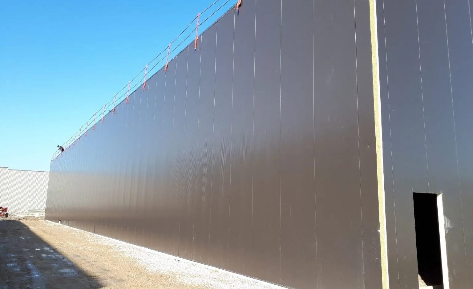 Fire-rated wall panels in a pharmaceutical building