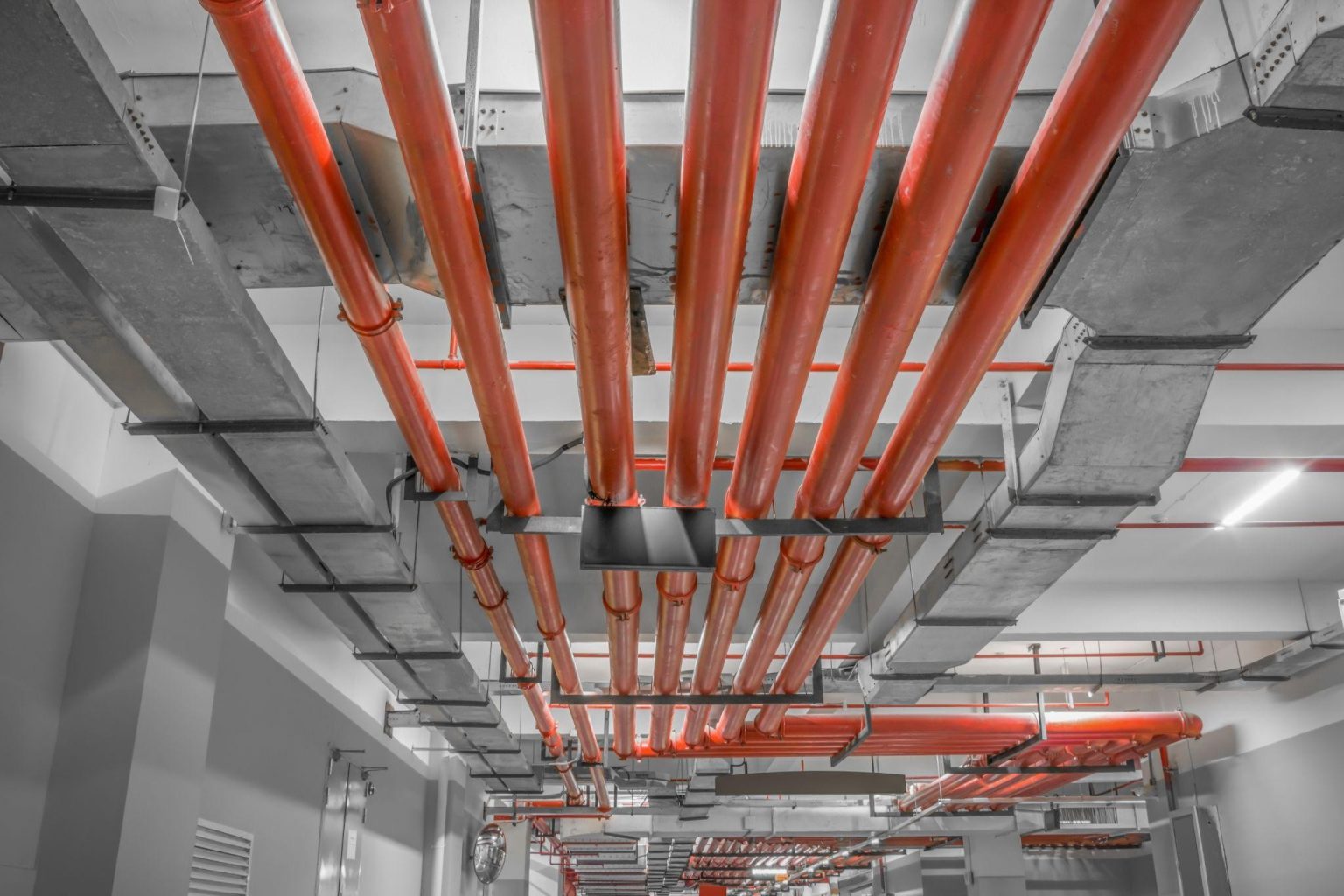 Industrial building with red pipe fire sprinkler system