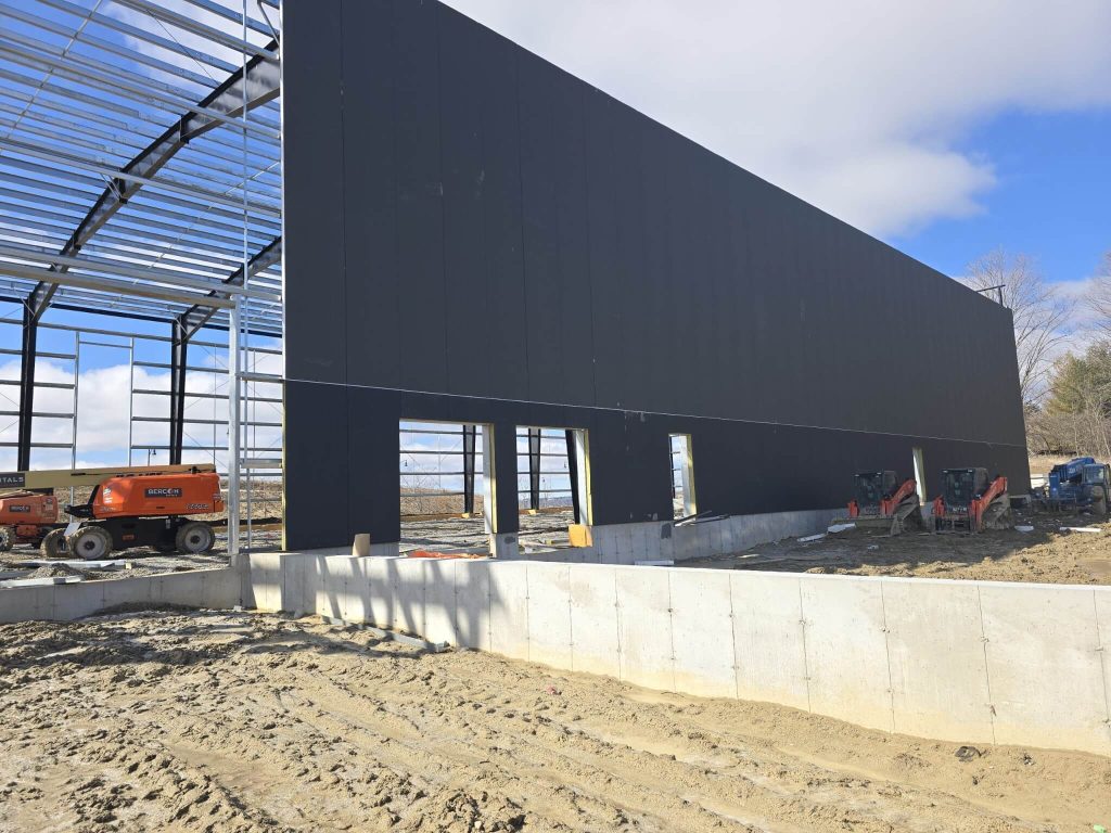 Insulated wall panels used in the new construction of a baseball training facility