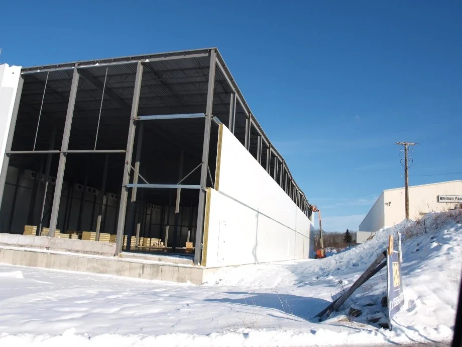 Exterior of a cold storage facility being constructed in winter